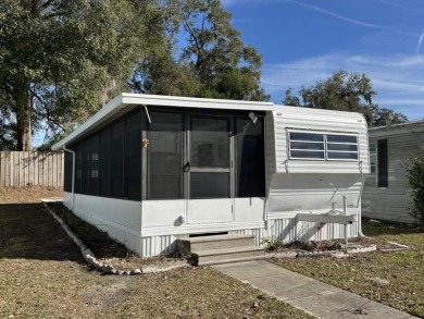 THIS FRESHLY REHABBED HOME OFFERS TINY HOUSE LIVING IN ONE OF on Triple S Golf Ranch in Florida - for sale on GolfHomes.com, golf home, golf lot