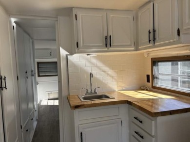 THIS FRESHLY REHABBED HOME OFFERS TINY HOUSE LIVING IN ONE OF on Triple S Golf Ranch in Florida - for sale on GolfHomes.com, golf home, golf lot