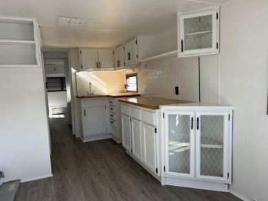 THIS FRESHLY REHABBED HOME OFFERS TINY HOUSE LIVING IN ONE OF on Triple S Golf Ranch in Florida - for sale on GolfHomes.com, golf home, golf lot