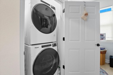 BETTER THAN NEW! 30k lot upgrade, large fenced yard. This 2024 on Trilogy at Ocala Preserve in Florida - for sale on GolfHomes.com, golf home, golf lot