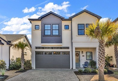 This contemporary home in Myrtle Beach offers clean design and on Cane Patch Driving Range in South Carolina - for sale on GolfHomes.com, golf home, golf lot