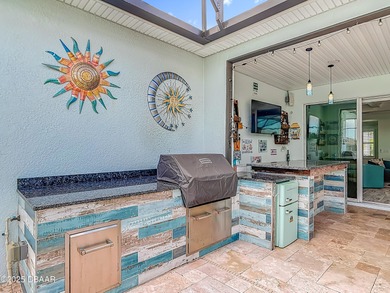 A Masterpiece of indoor-outdoor living in Latitude on LPGA International Golf Course in Florida - for sale on GolfHomes.com, golf home, golf lot