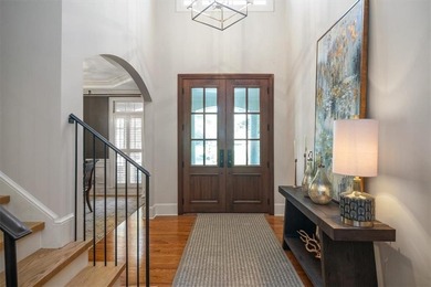 Discover timeless elegance and modern comfort in this on Woodmont Golf and Country Club in Georgia - for sale on GolfHomes.com, golf home, golf lot