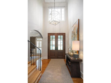 Discover timeless elegance and modern comfort in this on Woodmont Golf and Country Club in Georgia - for sale on GolfHomes.com, golf home, golf lot