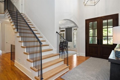 Discover timeless elegance and modern comfort in this on Woodmont Golf and Country Club in Georgia - for sale on GolfHomes.com, golf home, golf lot