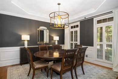 Discover timeless elegance and modern comfort in this on Woodmont Golf and Country Club in Georgia - for sale on GolfHomes.com, golf home, golf lot