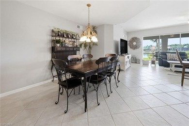 Fresh, light-filled and offered turnkey, this first-floor coach on The Rookery At Marco in Florida - for sale on GolfHomes.com, golf home, golf lot