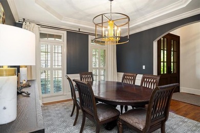 Discover timeless elegance and modern comfort in this on Woodmont Golf and Country Club in Georgia - for sale on GolfHomes.com, golf home, golf lot