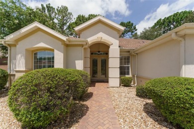Step into this pristine 2-bedroom, (plus Den/Office/Art on Eagle Ridge At Spruce Creek Country Club in Florida - for sale on GolfHomes.com, golf home, golf lot