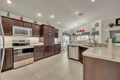 Stunning Expanded Iris Designer Home in the Village of on Egret Championship Golf Course in Florida - for sale on GolfHomes.com, golf home, golf lot