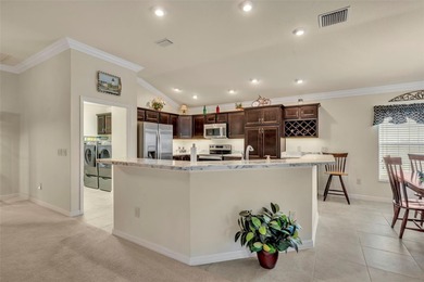 Stunning Expanded Iris Designer Home in the Village of on Egret Championship Golf Course in Florida - for sale on GolfHomes.com, golf home, golf lot