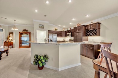 Stunning Expanded Iris Designer Home in the Village of on Egret Championship Golf Course in Florida - for sale on GolfHomes.com, golf home, golf lot