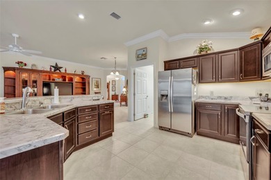 Stunning Expanded Iris Designer Home in the Village of on Egret Championship Golf Course in Florida - for sale on GolfHomes.com, golf home, golf lot