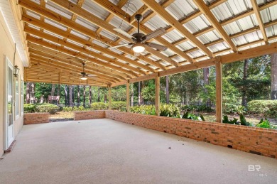 Golf Course Living in Lake Forest! Nestled on a tree-shaded lot on Lake Forest Yacht and Country Club in Alabama - for sale on GolfHomes.com, golf home, golf lot
