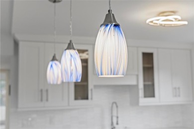 BRAND-NEW IMPACT SLIDING GLASS DOOR INSTALLED, Expanding the on Hillsboro Pines Golf in Florida - for sale on GolfHomes.com, golf home, golf lot