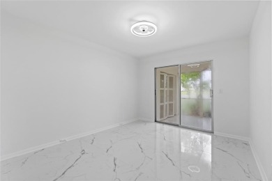 BRAND-NEW IMPACT SLIDING GLASS DOOR INSTALLED, Expanding the on Hillsboro Pines Golf in Florida - for sale on GolfHomes.com, golf home, golf lot