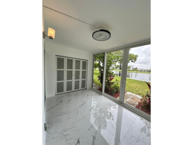 BRAND-NEW IMPACT SLIDING GLASS DOOR INSTALLED, Expanding the on Hillsboro Pines Golf in Florida - for sale on GolfHomes.com, golf home, golf lot