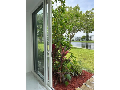 BRAND-NEW IMPACT SLIDING GLASS DOOR INSTALLED, Expanding the on Hillsboro Pines Golf in Florida - for sale on GolfHomes.com, golf home, golf lot