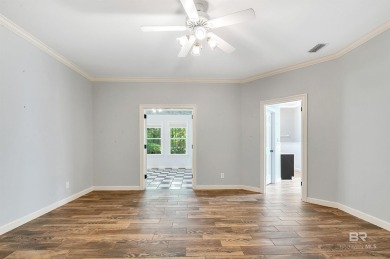 Golf Course Living in Lake Forest! Nestled on a tree-shaded lot on Lake Forest Yacht and Country Club in Alabama - for sale on GolfHomes.com, golf home, golf lot