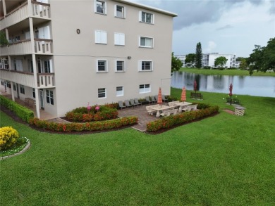 BRAND-NEW IMPACT SLIDING GLASS DOOR INSTALLED, Expanding the on Hillsboro Pines Golf in Florida - for sale on GolfHomes.com, golf home, golf lot