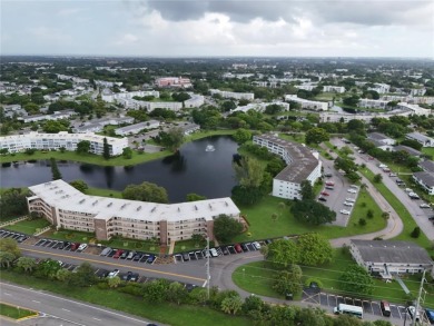 BRAND-NEW IMPACT SLIDING GLASS DOOR INSTALLED, Expanding the on Hillsboro Pines Golf in Florida - for sale on GolfHomes.com, golf home, golf lot