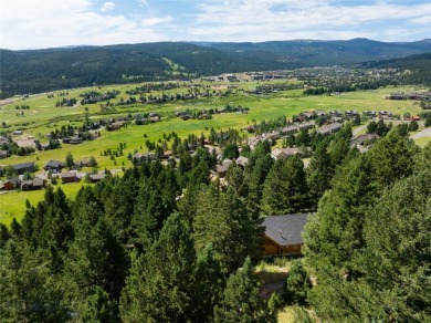 This charming log home, nestled in the trees and perched above on Big Sky of Montana Golf Course in Montana - for sale on GolfHomes.com, golf home, golf lot
