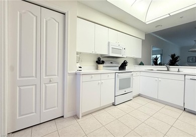 Hard-to-find FIRST-FLOOR 2BR + DEN / 2BA Veranda with garage in on Naples Heritage Golf and Country Club in Florida - for sale on GolfHomes.com, golf home, golf lot