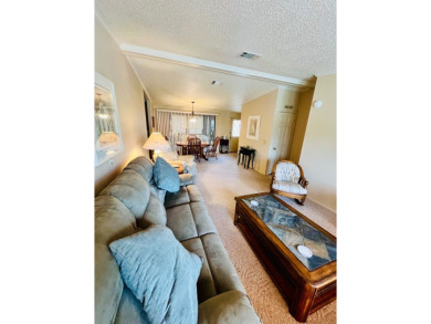 This spacious three-bedroom, two-bathroom home is located in the on Pine Lakes Country Club in Florida - for sale on GolfHomes.com, golf home, golf lot