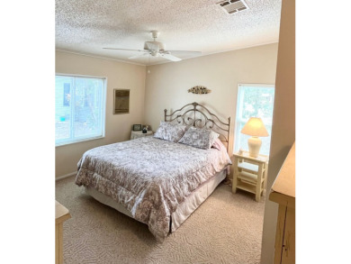 This spacious three-bedroom, two-bathroom home is located in the on Pine Lakes Country Club in Florida - for sale on GolfHomes.com, golf home, golf lot