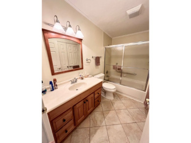 This spacious three-bedroom, two-bathroom home is located in the on Pine Lakes Country Club in Florida - for sale on GolfHomes.com, golf home, golf lot