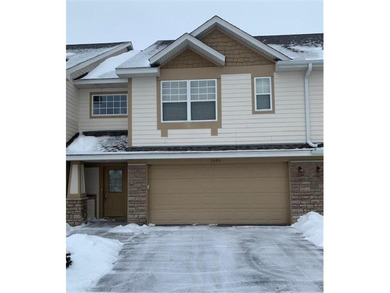 Multi-level walkout townhome with mature pine tree privacy on Deer Run Golf Club in Minnesota - for sale on GolfHomes.com, golf home, golf lot