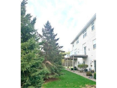Multi-level walkout townhome with mature pine tree privacy on Deer Run Golf Club in Minnesota - for sale on GolfHomes.com, golf home, golf lot