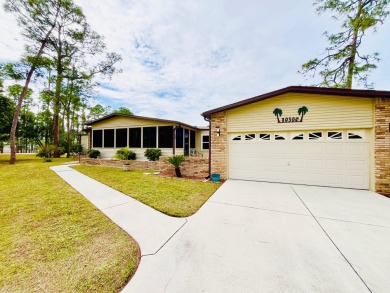 This spacious three-bedroom, two-bathroom home is located in the on Pine Lakes Country Club in Florida - for sale on GolfHomes.com, golf home, golf lot