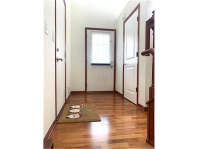 Multi-level walkout townhome with mature pine tree privacy on Deer Run Golf Club in Minnesota - for sale on GolfHomes.com, golf home, golf lot