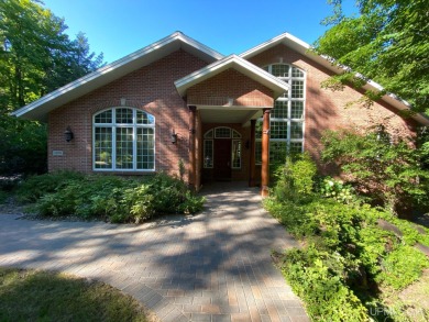 This executive home features 6750 sq. ft. Conveniently located on Marquette Golf Club in Michigan - for sale on GolfHomes.com, golf home, golf lot