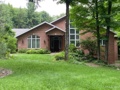 This executive home features 6750 sq. ft. Conveniently located on Marquette Golf Club in Michigan - for sale on GolfHomes.com, golf home, golf lot