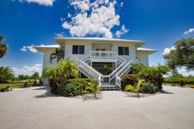 Nestled in a serene enclave, this exceptional property on Coral Creek Club in Florida - for sale on GolfHomes.com, golf home, golf lot