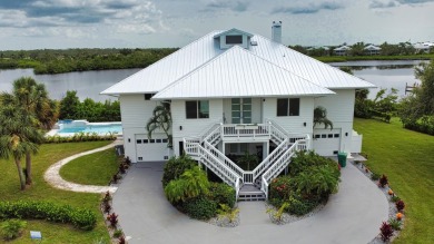 Nestled in a serene enclave, this exceptional property on Coral Creek Club in Florida - for sale on GolfHomes.com, golf home, golf lot