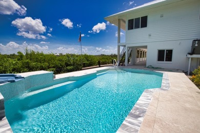 Nestled in a serene enclave, this exceptional property on Coral Creek Club in Florida - for sale on GolfHomes.com, golf home, golf lot