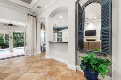 The 3 bedroom 3.5 bathroom home has a beautiful front elevation on Verandah Golf Course and Club in Florida - for sale on GolfHomes.com, golf home, golf lot