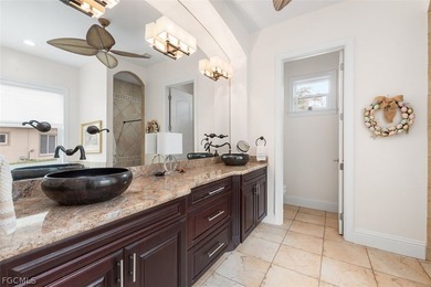 The 3 bedroom 3.5 bathroom home has a beautiful front elevation on Verandah Golf Course and Club in Florida - for sale on GolfHomes.com, golf home, golf lot