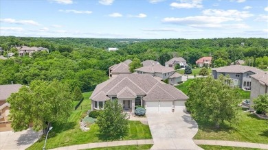 This is a stunning reverse 1.5-story home with picturesque views on Fred Arbanas Golf Course At Longview Lakes - Longview Lake in Missouri - for sale on GolfHomes.com, golf home, golf lot