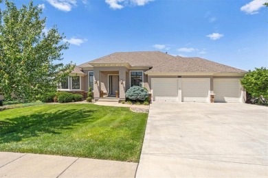 This is a stunning reverse 1.5-story home with picturesque views on Fred Arbanas Golf Course At Longview Lakes - Longview Lake in Missouri - for sale on GolfHomes.com, golf home, golf lot