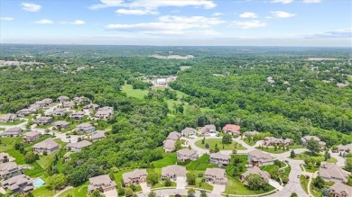 This is a stunning reverse 1.5-story home with picturesque views on Fred Arbanas Golf Course At Longview Lakes - Longview Lake in Missouri - for sale on GolfHomes.com, golf home, golf lot