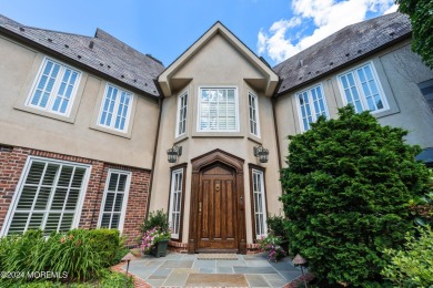 This stunning 5-bedroom, 5.5-bathroom English Tudor waterfront on Navesink Country Club in New Jersey - for sale on GolfHomes.com, golf home, golf lot