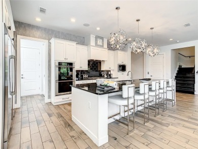 Welcome to 550 Muirfield Loop - The Epitome of Luxury in Reunion on ChampionsGate Golf Resort in Florida - for sale on GolfHomes.com, golf home, golf lot