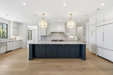 COMPLETELY RENOVATED. REIMAGINED. PRACTICALLY REBUILT FROM THE on Great Waters Course At Reynolds Plantation in Georgia - for sale on GolfHomes.com, golf home, golf lot