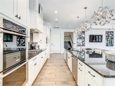 Welcome to 550 Muirfield Loop - The Epitome of Luxury in Reunion on ChampionsGate Golf Resort in Florida - for sale on GolfHomes.com, golf home, golf lot