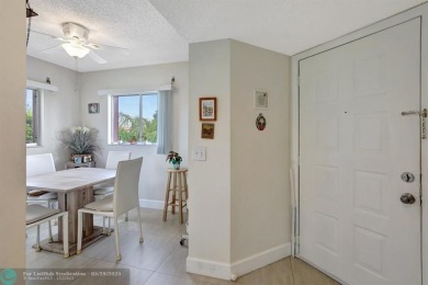 This immaculate corner unit in a newer building of a great 55+ on Flamingo Lakes Country Club in Florida - for sale on GolfHomes.com, golf home, golf lot