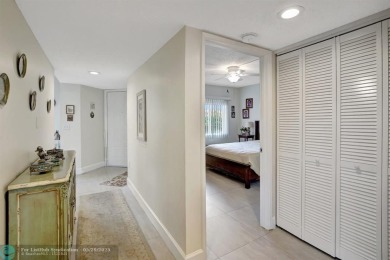 This immaculate corner unit in a newer building of a great 55+ on Flamingo Lakes Country Club in Florida - for sale on GolfHomes.com, golf home, golf lot